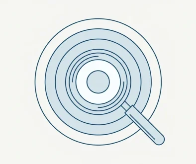 Line illustration of a magnifying glass held above four concentric rings